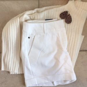 Mid rise white shorts.